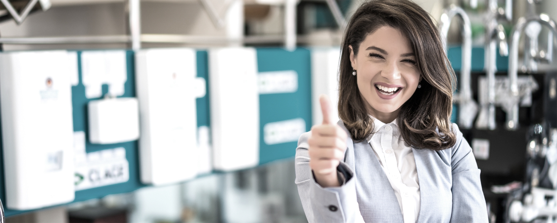 Woman smiling with thumbs up