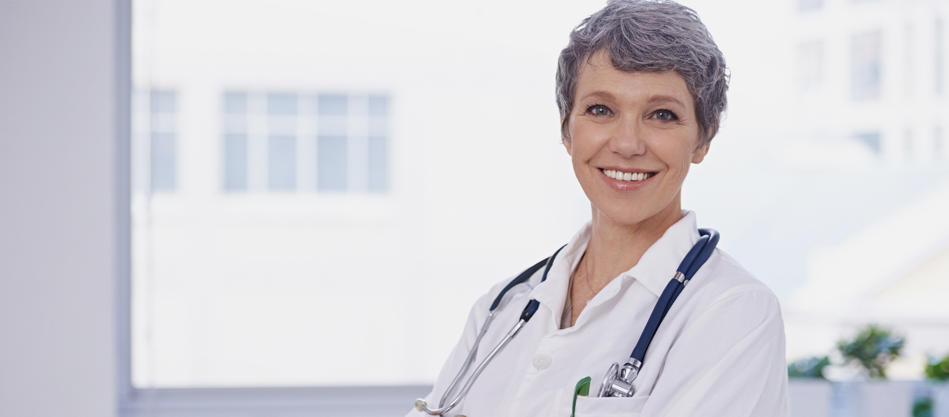 a doctor smiling at the camera