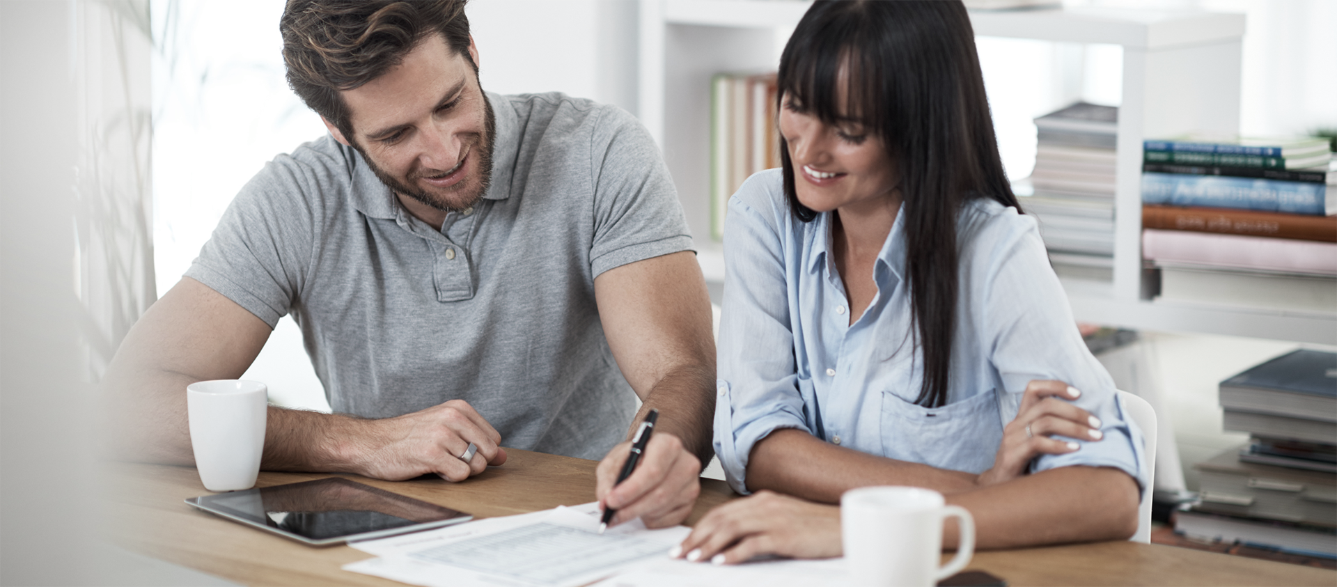 man an woman doing paperwork together